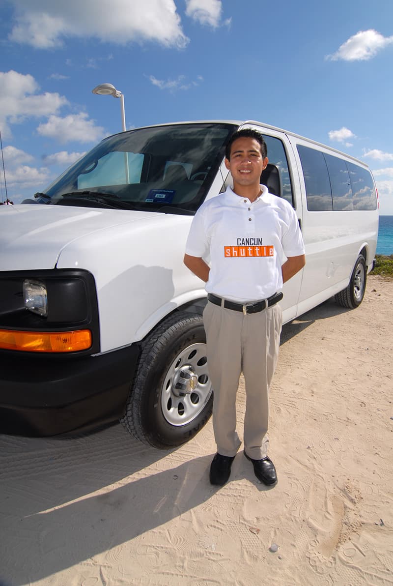 cancunshuttle driver standing by his vehicle